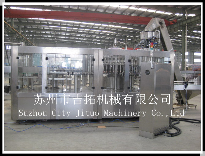 可乐、雪碧含气饮料三合一灌装机,苏州市吉拓机械有限公司专业制造。