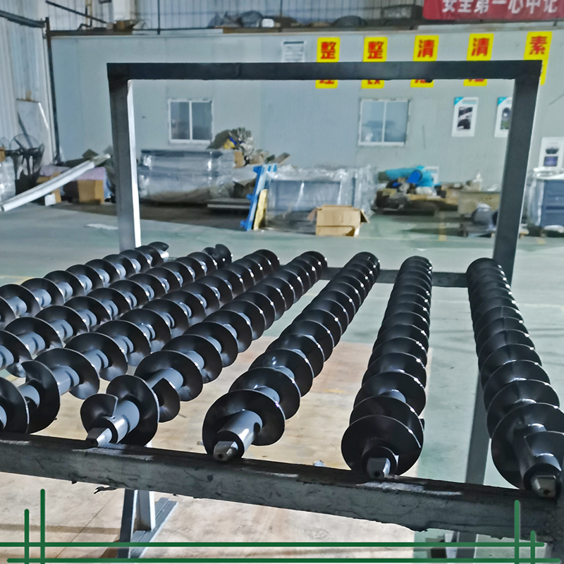 Where is tungsten carbide sprayed on spiral axis used